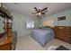 Bright bedroom with double bed, dresser, and ceiling fan at 5326 22Nd N Ave, St Petersburg, FL 33710