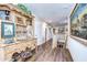 Upstairs hallway featuring a wooden hutch and hardwood floors at 7974 Tasso Ct, Seminole, FL 33777