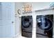 Laundry room with Samsung washer and dryer and ample storage at 7974 Tasso Ct, Seminole, FL 33777