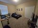 Cozy bedroom with carpeted floors, a window and a closet at 8451 Karpeal Dr, Sarasota, FL 34238