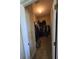 A walk-in closet features ample storage space with hanging racks and shelves at 8451 Karpeal Dr, Sarasota, FL 34238