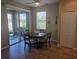 Cozy dining area with sliding glass doors leading to an outdoor patio at 8451 Karpeal Dr, Sarasota, FL 34238