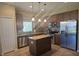 Well-equipped kitchen with stainless steel appliances, granite countertops, and ample cabinet space at 8451 Karpeal Dr, Sarasota, FL 34238