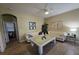 Comfortable living room with neutral walls, tile floors, modern decor, and lots of natural light at 8451 Karpeal Dr, Sarasota, FL 34238
