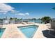 Relaxing community pool and spa area with lounge chairs and waterfront views at 9219 Captiva Cir, St Pete Beach, FL 33706