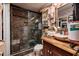 Bathroom with stone tiled shower and unique vanity at 10200 Gandy N Blvd # 1313, St Petersburg, FL 33702