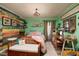 Whimsical bedroom with colorful accent wall and cozy sitting area at 10200 Gandy N Blvd # 1313, St Petersburg, FL 33702