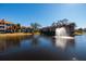 Community with a pond and water fountain, surrounded by residential buildings at 10200 Gandy N Blvd # 1313, St Petersburg, FL 33702