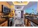 Kitchen featuring stainless steel appliances, dark wood countertops, and colorful decor at 10200 Gandy N Blvd # 1313, St Petersburg, FL 33702