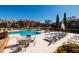 Inviting pool area with lounge chairs, tables, and lush landscaping at 10200 Gandy N Blvd # 1313, St Petersburg, FL 33702