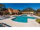 Community pool with seating areas, mature trees, and a clubhouse at 10200 Gandy N Blvd # 1313, St Petersburg, FL 33702