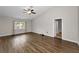 Large living room featuring wood-look floors and a ceiling fan at 10463 Wren Rd, Brooksville, FL 34613