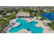 An aerial view of the community pool, featuring a unique shape and plenty of space for residents at 10707 Banfield Dr, Riverview, FL 33579