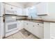 Clean kitchen, featuring white cabinets and modern appliances at 11373 121St Ter, Largo, FL 33778