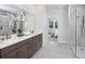 Modern bathroom with double vanities, large shower, and elegant fixtures at 11550 Myakka Blue Dr, Venice, FL 34293