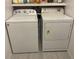 Stackable Whirlpool washer and dryer in a well-lit laundry room at 14165 89Th Ave, Seminole, FL 33776