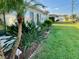 Landscaped side yard with lush tropical plants at 14165 89Th Ave, Seminole, FL 33776