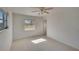 Spacious bedroom with ceiling fan and window at 1535 Council Dr, Sun City Center, FL 33573