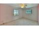 Spacious bedroom with carpet, ceiling fan and window at 1535 Council Dr, Sun City Center, FL 33573