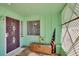 Front entry with decorative door and wooden bench at 1535 Council Dr, Sun City Center, FL 33573