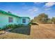 Ranch style home with green exterior and yard at 1535 Council Dr, Sun City Center, FL 33573