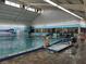 Indoor pool with separate spa and seating area at 1535 Council Dr, Sun City Center, FL 33573