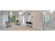 Bright living room with a breakfast bar and mirrored wall at 1535 Council Dr, Sun City Center, FL 33573