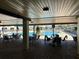 Community pool with shaded seating at 1535 Council Dr, Sun City Center, FL 33573