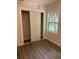 Spacious bedroom with double door closet and light grey vinyl flooring at 1714 2Nd E Ave, Bradenton, FL 34208