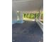 Covered carport with asphalt driveway and backyard view at 1714 2Nd E Ave, Bradenton, FL 34208