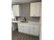 Newly remodeled kitchen with white shaker cabinets and quartz countertops at 1714 2Nd E Ave, Bradenton, FL 34208