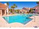 Community pool with lounge chairs and palm trees at 18128 Villa Creek Dr # 18128, Tampa, FL 33647