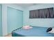 Comfortable bedroom with light blue walls and a queen-size bed at 18675 Us Highway 19 N # 189, Clearwater, FL 33764