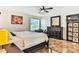 Main bedroom with a king-size bed and dark wood furniture at 19811 Gulf Blvd # 102, Indian Shores, FL 33785