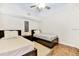Guest bedroom with twin beds and dark wood furniture at 19811 Gulf Blvd # 102, Indian Shores, FL 33785