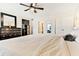 Spacious bedroom with large bed, dresser, and ceiling fan at 19811 Gulf Blvd # 102, Indian Shores, FL 33785