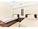Guest bedroom with two twin beds and dark wood furniture at 19811 Gulf Blvd # 102, Indian Shores, FL 33785
