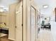 Stackable washer and dryer in a hallway near bedroom and living area at 19811 Gulf Blvd # 102, Indian Shores, FL 33785