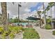 Inviting pool area with lounge chairs and shade structure at 2324 New Orchard Ct, Sun City Center, FL 33573