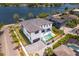 Aerial view of a modern home with pool, showcasing backyard and waterfront lot at 2926 Coffee Pot Ne Blvd, St Petersburg, FL 33704