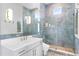 Modern bathroom with a walk-in shower and quartz countertop at 2926 Coffee Pot Ne Blvd, St Petersburg, FL 33704