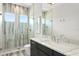 Modern bathroom with walk-in shower and marble vanity at 2926 Coffee Pot Ne Blvd, St Petersburg, FL 33704