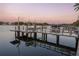 Private boat dock with multiple slips at sunset at 2926 Coffee Pot Ne Blvd, St Petersburg, FL 33704