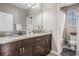 Double sink bathroom with shower and bathtub at 3994 Medicci Ln, Wesley Chapel, FL 33543