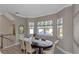 Elegant dining room with an oval table and bay window at 4069 Rocky Shores Dr, Tampa, FL 33634