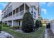 Townhouse exterior with screened porch and landscaping at 4069 Rocky Shores Dr, Tampa, FL 33634