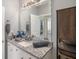 Bathroom with granite countertop, sink, and large mirror at 4221 W Spruce St # 2418, Tampa, FL 33607
