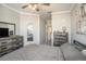 Bright bedroom with queen bed, dresser, and access to bathroom at 4221 W Spruce St # 2418, Tampa, FL 33607
