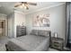 Bedroom with queen bed, nightstands, and large wall art at 4221 W Spruce St # 2418, Tampa, FL 33607