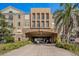 Building exterior with a covered entrance and landscaping at 4221 W Spruce St # 2418, Tampa, FL 33607